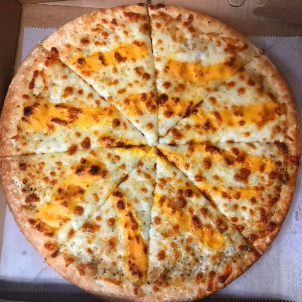 A whole Mikie's Pizza & Subs cheese pizza, cut into eight slices, in a cardboard box.